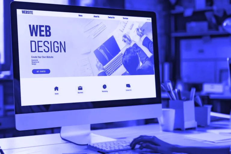 Desktop monitor displaying a web design layout